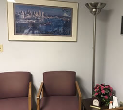 image inside a clinic with two brown chairs